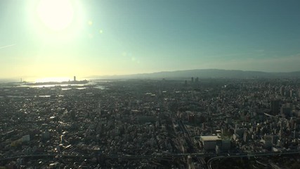 OSAKA, JAPAN - CIRCA SEPTEMBER 2019 : Aerial high angle view of CITYSCAPE of OSAKA in early evening sunset time. Osaka is the second largest metropolitan area in Japan.