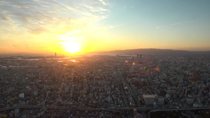 OSAKA, JAPAN - CIRCA SEPTEMBER 2019 : Aerial high angle view of CITYSCAPE of OSAKA in early evening sunset time. Osaka is the second largest metropolitan area in Japan.