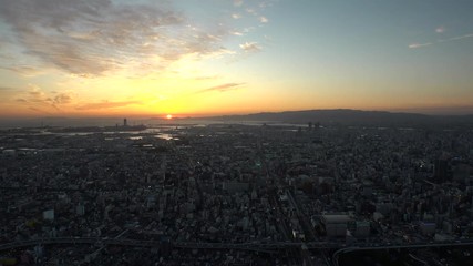 OSAKA, JAPAN - CIRCA SEPTEMBER 2019 : Aerial high angle view of CITYSCAPE of OSAKA in early evening sunset time. Osaka is the second largest metropolitan area in Japan.