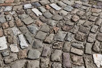 Dark pavement made of old stones