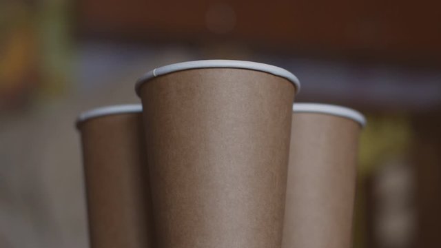 empty Disposable eco (bio) cups Kraft 2x layer.disposable paper cups. Rotation. Close-up