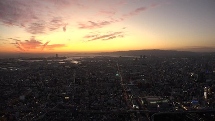 OSAKA, JAPAN - CIRCA SEPTEMBER 2019 : Aerial high angle view of CITYSCAPE of OSAKA in early evening sunset time. Osaka is the second largest metropolitan area in Japan.