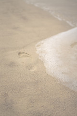 foot shape on the beach