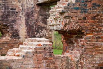 Destroyed by time and war, the old red brick wall inside the house.