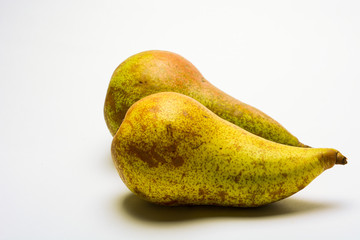 ripe pears on white background