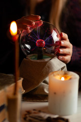 Seer with magic ball performs ritual. Psychic vision, fortune teller.