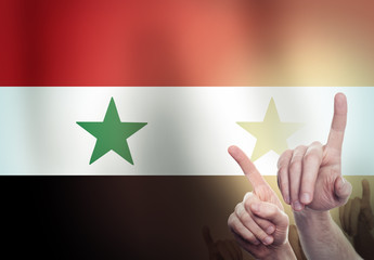 Two hands shackled a metal chain on the background of the Syria flag. Freedom concept