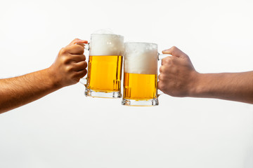 Hands toasting with beer on white background