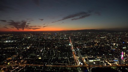 OSAKA, JAPAN - CIRCA SEPTEMBER 2019 : Aerial high angle view of CITYSCAPE of OSAKA in early evening sunset time. Osaka is the second largest metropolitan area in Japan.