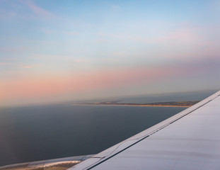 Fototapeta na wymiar Close up Airplane window with airplane wing