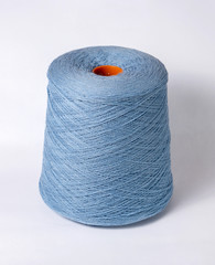 bobbin of yarn on a white background. Side view.Textile reel on isolated white background.