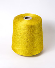 bobbin of yarn on a white background. Side view.Textile reel on isolated white background.