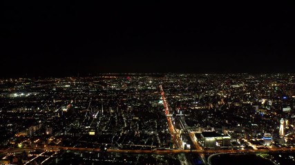 OSAKA, JAPAN - CIRCA SEPTEMBER 2019 : Aerial high angle sunrise view of CITYSCAPE of OSAKA. Time lapse shot, night to morning. Osaka is the second largest metropolitan area in Japan.