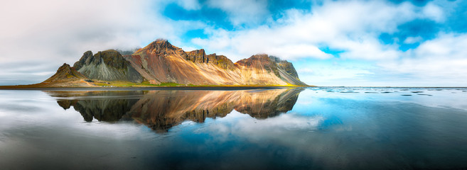 Fototapeta Splendid sunny day and gorgeous reflection of Vestrahorn mountaine on Stokksnes cape in Iceland. obraz