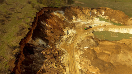 Aerial view of sand quarry with bulldozer