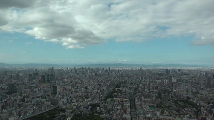 OSAKA, JAPAN - CIRCA SEPTEMBER 2019 : Aerial high angle view of CITYSCAPE of OSAKA in daytime. Osaka is the second largest metropolitan area in Japan. Time lapse shot.