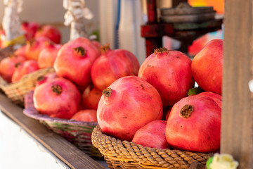 a lot of fresh pomegranates in the market