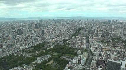 OSAKA, JAPAN - CIRCA SEPTEMBER 2019 : Aerial high angle view of CITYSCAPE of OSAKA in daytime. Osaka is the second largest metropolitan area in Japan. Time lapse shot.