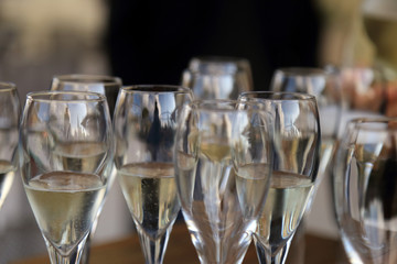 Glass glasses with prosecco - setting up the glasses on the table in the restaurant for an aperitif