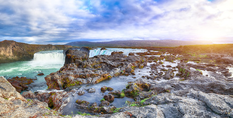 Breathtaking sunset landscape scene of powerful Godafoss waterfall