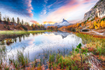 Fototapeta premium Wonderfull autumn view of Lake Federa in Dolomites at sunset