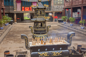 Censer in the courtyard of the City God Temple in the old town of Pingyao