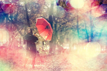 Autumn umbrella girl in the park October walk in the rain