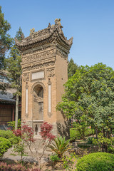 Fototapeta premium Rear view of a decorated ornamental gate in the garden of the Great Mosque in Xi'an