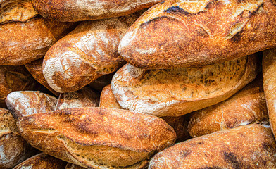 Close up of French baguettes piled together