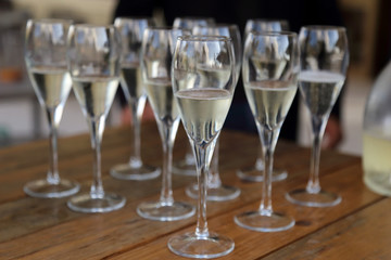 Glass glasses with prosecco - setting up the glasses on the table in the restaurant for an aperitif
