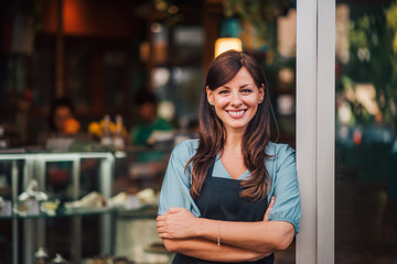 Portrait of a beautiful smiling female small business owner. - Powered by Adobe