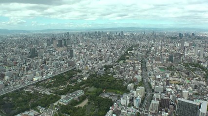 OSAKA, JAPAN - CIRCA SEPTEMBER 2019 : Aerial high angle view of CITYSCAPE of OSAKA in daytime. Osaka is the second largest metropolitan area in Japan. Time lapse shot.
