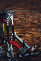 Close up tools on a wooden background.