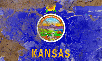 Kansas grunge, damaged, scratch, old style state flag on wall.