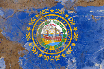 New Hampshire grunge, damaged, scratch, old style state flag on wall.