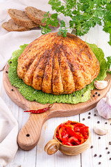  ham on a cutting board with fresh herbs and spices