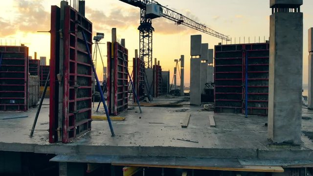 Concrete buildings in progress at the project site. Aerial view of construction site.