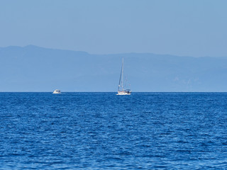 Sailing boat at an open sea, Greece