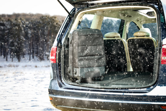 Winter Car And Black Suitcase 