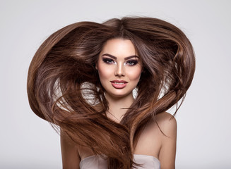 Naklejka premium Portrait of a beautiful woman with a long hair.