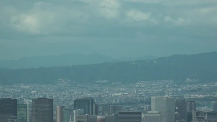 OSAKA, JAPAN - CIRCA SEPTEMBER 2019 : Aerial high angle view of CITYSCAPE of OSAKA in daytime. Osaka is the second largest metropolitan area in Japan. Zoom out shot.