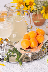 Refreshing drink with lemon and honey on a tray