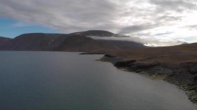 4K High Quality travel inspired series - slow motion drone footage in the Arctic Ocean. Sea Ships, research vessles, ice burgs, glaciers, ocean, zodiacs, moody and beautiful.