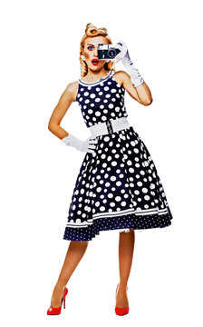 Full body portrait of woman with noname old film camera, taking picture, dressed in pin up style dress in polka dot. Raster illustration.
