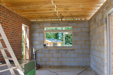 Residential renovation project unfinished garage in building blocks, roof structure