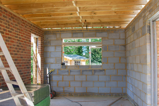 Residential renovation project unfinished garage in building blocks, roof structure