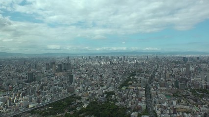 OSAKA, JAPAN - CIRCA SEPTEMBER 2019 : Aerial high angle view of CITYSCAPE of OSAKA in daytime. Osaka is the second largest metropolitan area in Japan. Zoom in shot.