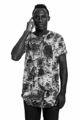 Young black African man talking on mobile phone