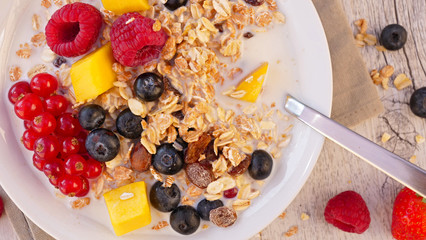 muesli, milk and fruit- top view