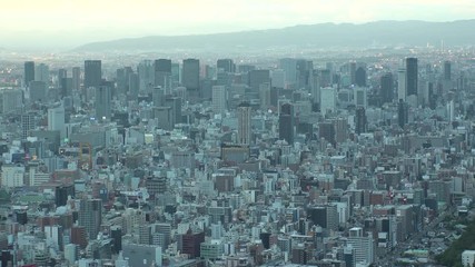OSAKA, JAPAN - CIRCA SEPTEMBER 2019 : Aerial high angle view of CITYSCAPE of OSAKA in early evening sunset time. Osaka is the second largest metropolitan area in Japan.